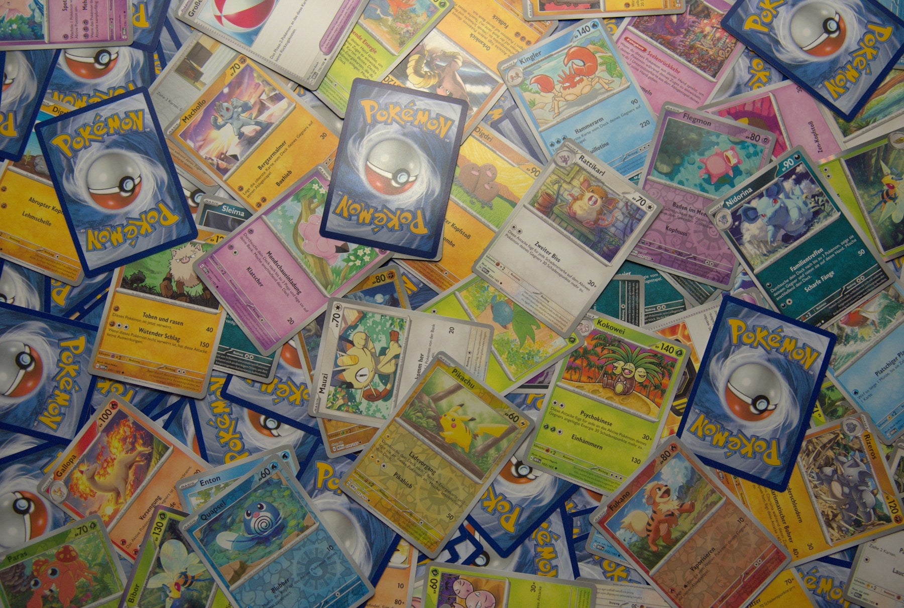 Trading cards arranged across a collector table